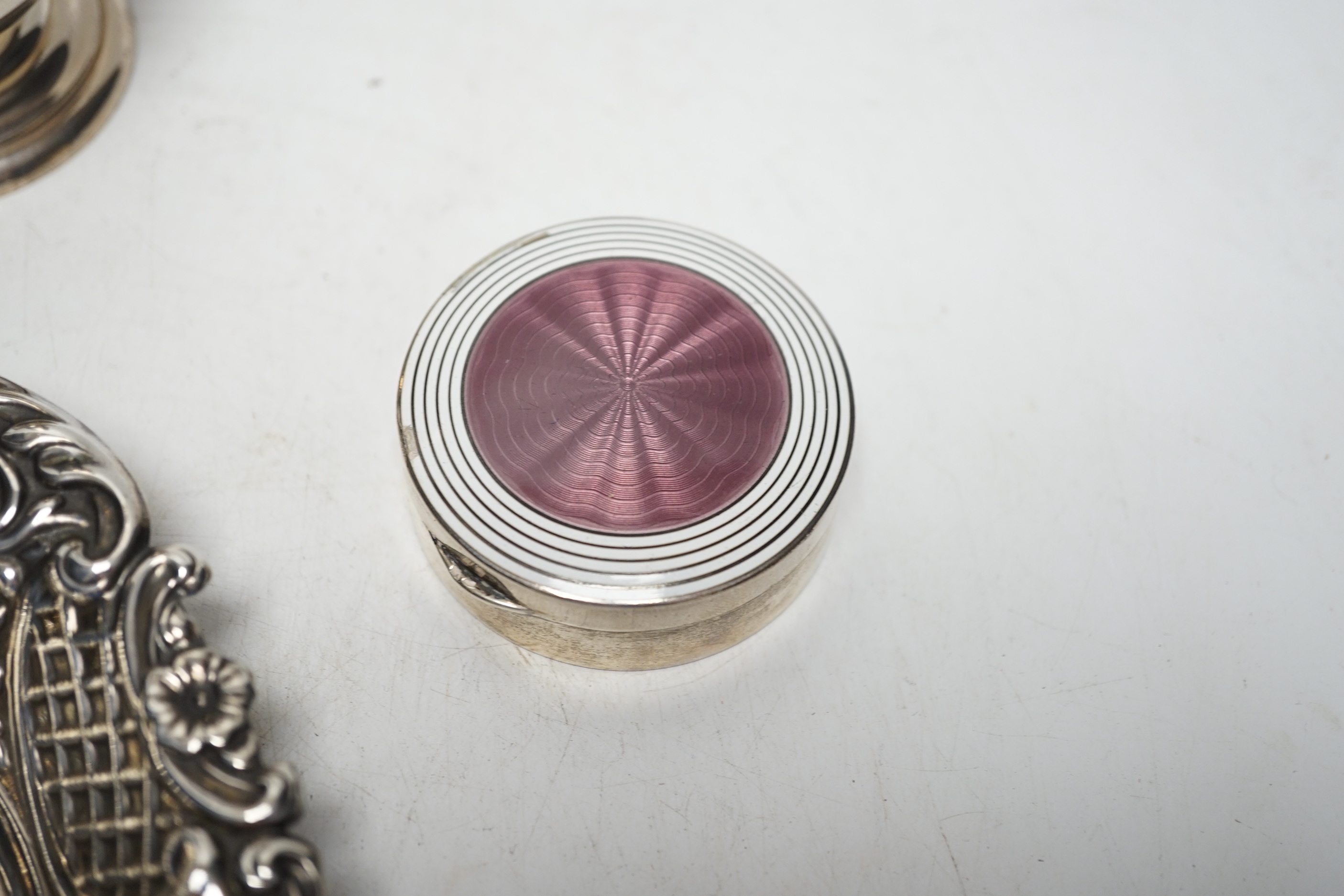 A 1930's silver sugar caster, 16.2cm, a silver five bar toastrack, two silver bonbon dishes and an early 20th century German 900 standard and two colour enamel circular pill box and cover, by Louis Kuppenheim (enamel a.f